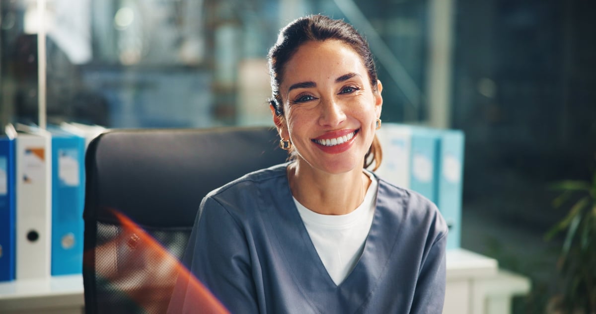 Happy female doctor portrait in hospital